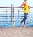 Fitness woman looking into distance and listening to the music Royalty Free Stock Photo