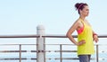 Fitness woman looking into distance and listening to the music Royalty Free Stock Photo