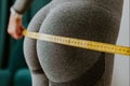 Fitness Woman Measuring butt With Tape at home. strong buttocks concept.