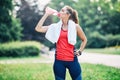 fitness woman park exercise lifestyle outdoor sport healthy female nature active young water drinking Royalty Free Stock Photo