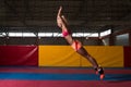 Fitness Woman Performing a Long Jump In Gym Royalty Free Stock Photo