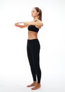 Fitness woman performs exercises for the muscles of the hands with resistance band Royalty Free Stock Photo