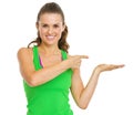 Fitness woman presenting something on empty palm