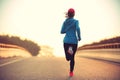 Fitness woman runner athlete running at road