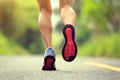 Fitness woman runner legs running on forest trail Royalty Free Stock Photo