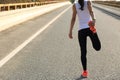 Fitness woman runner stretching legs before run Royalty Free Stock Photo