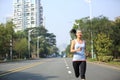 Fitness woman running at city street Royalty Free Stock Photo