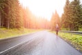 Fitness woman running at the morning in mountains. Royalty Free Stock Photo