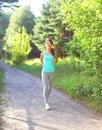 Fitness woman running in park, female runner workout, sport and healthy lifestyle Royalty Free Stock Photo