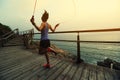 Fitness woman skipping rope at seaside Royalty Free Stock Photo