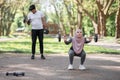 Active arabian couple workout with dumbbells outdoors