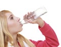 Fitness woman sport girl with towel drinking water from bottle isolated Royalty Free Stock Photo