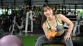 Fitness woman in sportswear working out with kettlebells in the gym. Royalty Free Stock Photo