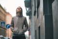 Fitness woman standing near building in city Royalty Free Stock Photo