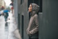 Fitness woman standing near building in city Royalty Free Stock Photo