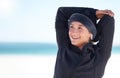 Fitness, woman and stretching arms on beach in preparation for exercise, cardio workout or training. Happy sporty female Royalty Free Stock Photo