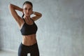 Fitness Woman Stretching Arms In Stylish Black Sport Clothes