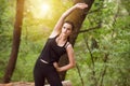 Fitness Woman Stretching In Wooded Forest Area Royalty Free Stock Photo