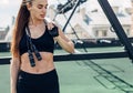 Fitness woman taking a break standing with jumping rope