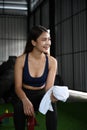 Fitness woman taking rest after exercising at gym. Royalty Free Stock Photo