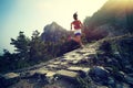 Woman trail runner running at great wall on the top of mountain Royalty Free Stock Photo