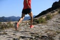 Fitness woman trail runner running on top of mountain Royalty Free Stock Photo