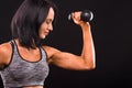 Fitness woman training with dumbbells