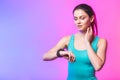 Fitness woman using fitness tracker on wrist over white background. A woman using a smartwatch. Healthy lifestyle. Copy space Royalty Free Stock Photo