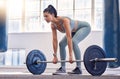 Fitness, woman and weightlifting barbell for workout, exercise or intense training at the gym. Active female exercising Royalty Free Stock Photo