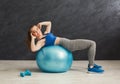 Fitness woman working on abs with fitness ball Royalty Free Stock Photo