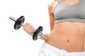 Fitness woman working out dumbbells in gym Royalty Free Stock Photo