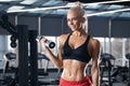 Fitness woman working out in gym. Beautifu athletic girl with flat belly Royalty Free Stock Photo