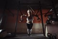Fitness woman workout on the TRX in the gym Royalty Free Stock Photo
