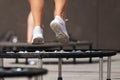 Fitness women jumping on small trampolines Royalty Free Stock Photo