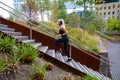 Fitness women running fast intervals in stairs in city park