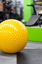 Fitness on wooden floor. Sports balls. Yoga ball in fitness room.Exercise yellow color ball in fitness, gym equipment and fitness Royalty Free Stock Photo