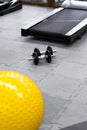 Fitness on wooden floor. Sports balls. Yoga ball in fitness room.Exercise yellow color ball in fitness, gym equipment and fitness Royalty Free Stock Photo