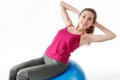 Fitness Workout. Sporty Woman Doing Bicycle Crunch Abs Exercise Lying On Floor Over Pink And Blue Neon Studio Background Royalty Free Stock Photo