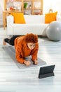 Fitness Workout training. Young healthy fit african girl doing plank exercise on yoga mat on floor at home. Athletic Royalty Free Stock Photo