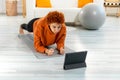 Fitness Workout training. Young healthy fit african girl doing plank exercise on yoga mat on floor at home. Athletic Royalty Free Stock Photo