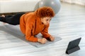 Fitness Workout training. Young healthy fit african girl doing plank exercise on yoga mat on floor at home. Athletic Royalty Free Stock Photo