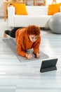 Fitness Workout training. Young healthy fit african girl doing plank exercise on yoga mat on floor at home. Athletic Royalty Free Stock Photo