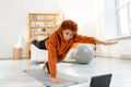 Fitness Workout training. Young healthy fit african girl doing sports exercise on yoga mat on floor at home. Athletic Royalty Free Stock Photo