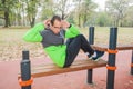 Fitness Young Man Doing Sit-Ups At Outdoor Sports Park Royalty Free Stock Photo
