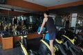 Asian chinese Fitness young man on gym bike spinning Royalty Free Stock Photo