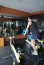 Asian chinese Fitness young man on gym bike spinning Royalty Free Stock Photo