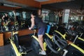 Asian chinese Fitness young man on gym bike spinning Royalty Free Stock Photo