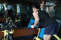 Asian chinese Fitness young man on gym bike spinning Royalty Free Stock Photo