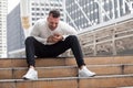 fitness young man have chest pains or heart attack in workout exercising on street in urban city . Tired sport male rest after Royalty Free Stock Photo