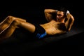 Fitness young man working abs